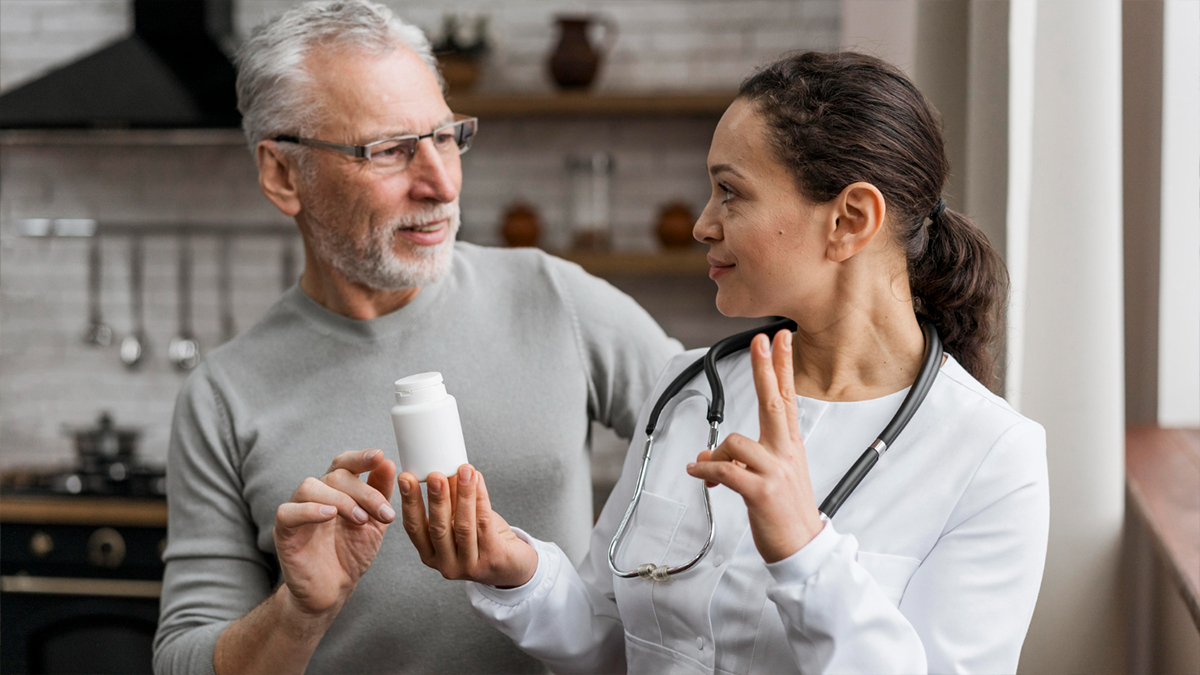 Elderly man talking to his doctor