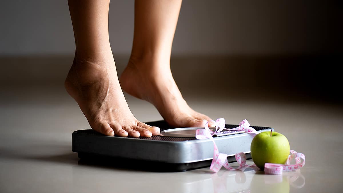 Women on weighing machine