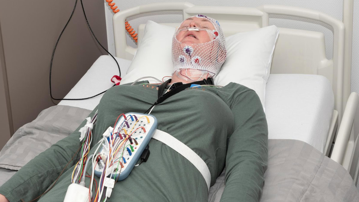 Person with multiple monitors attached to her body