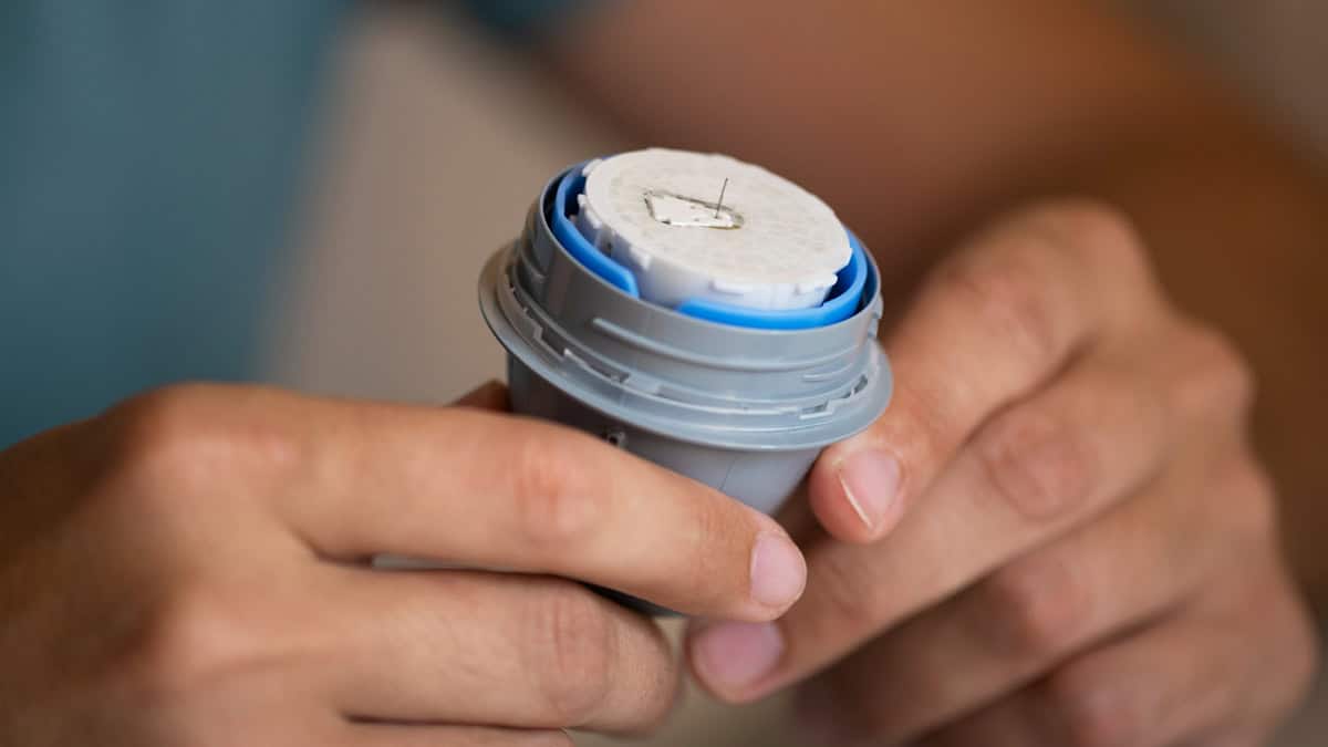 Person with a new blood glucose sensor