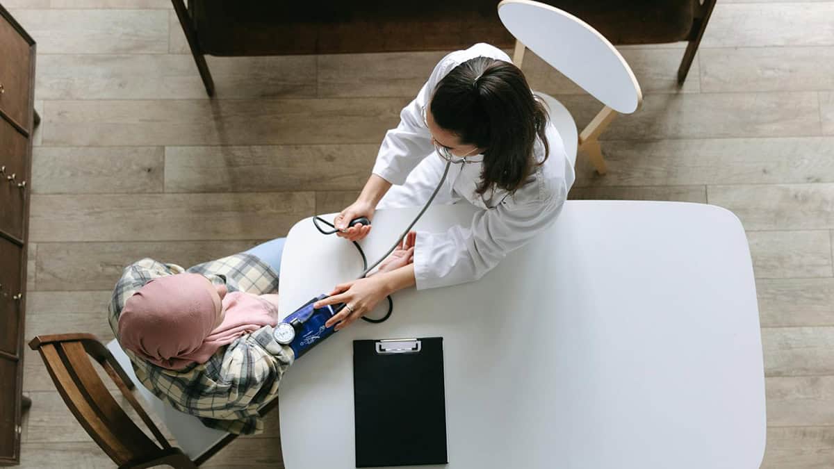 Doctor examining her patient