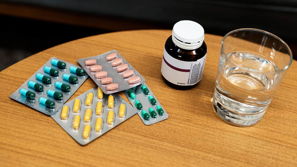 Various medication tablet packs on table