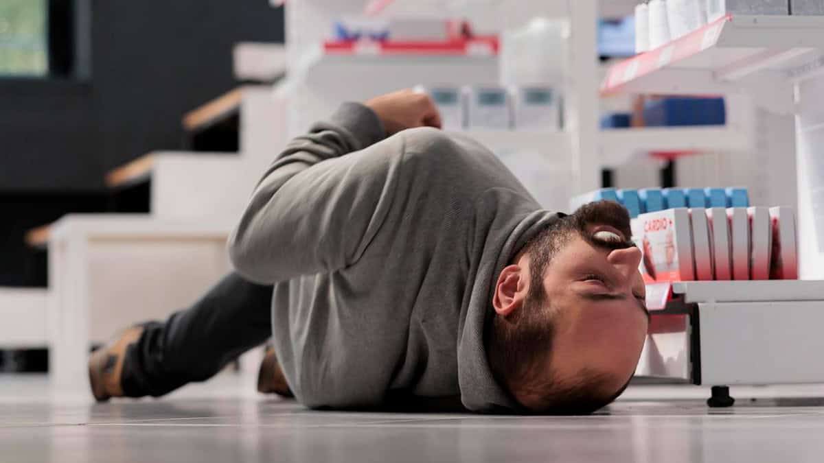 Person having a seizure while shopping