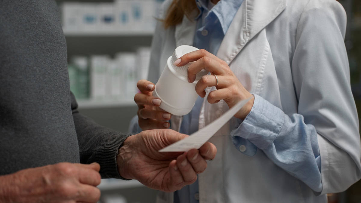 Doctor helping patient with selecting medication