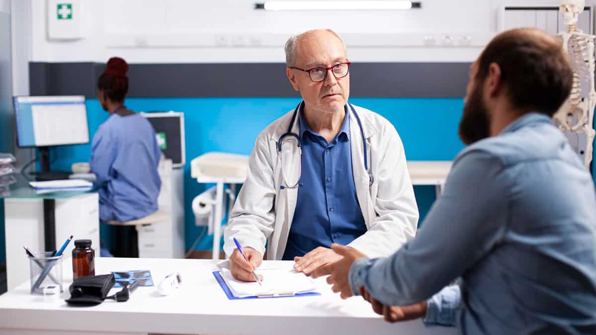 Doctor talking to his patient