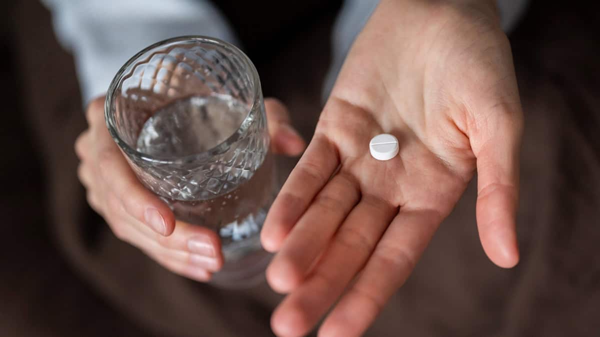 Person taking a pill