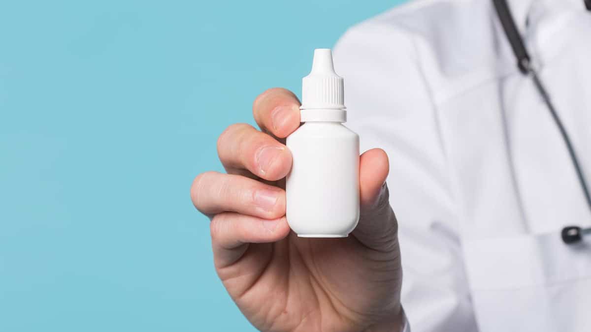 Doctor showing eye drops