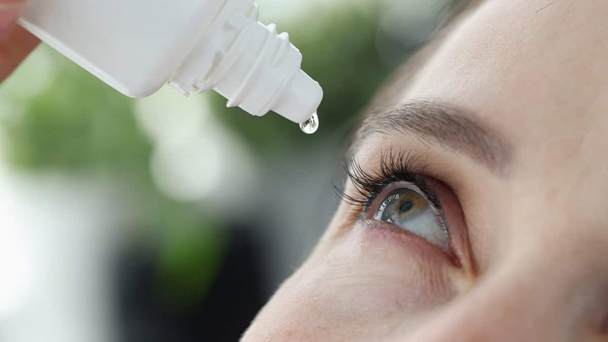 Person using eye drops