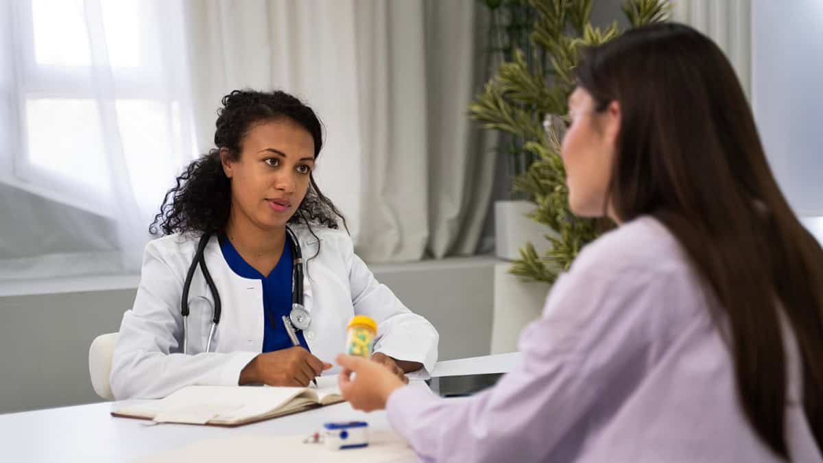 Person talking to her doctor about medication