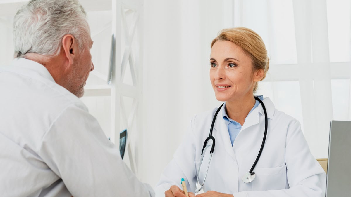 Person taking to his doctor