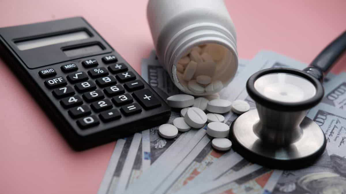 Money, calculator and medication