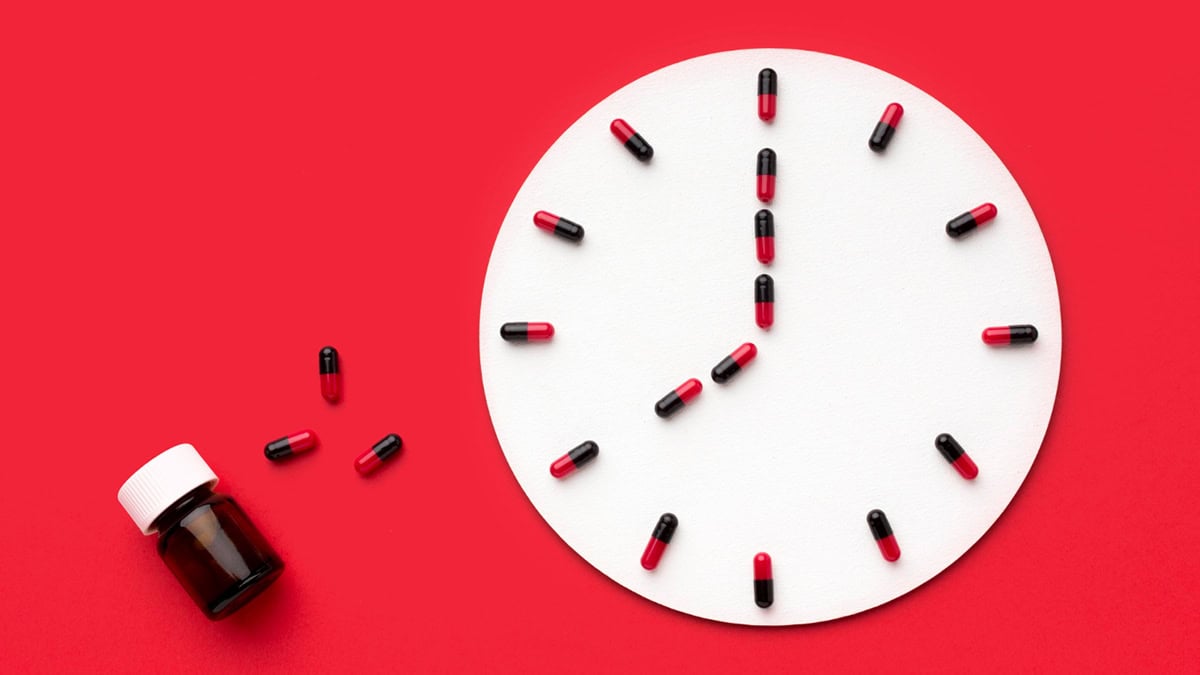 Medication pills and clock