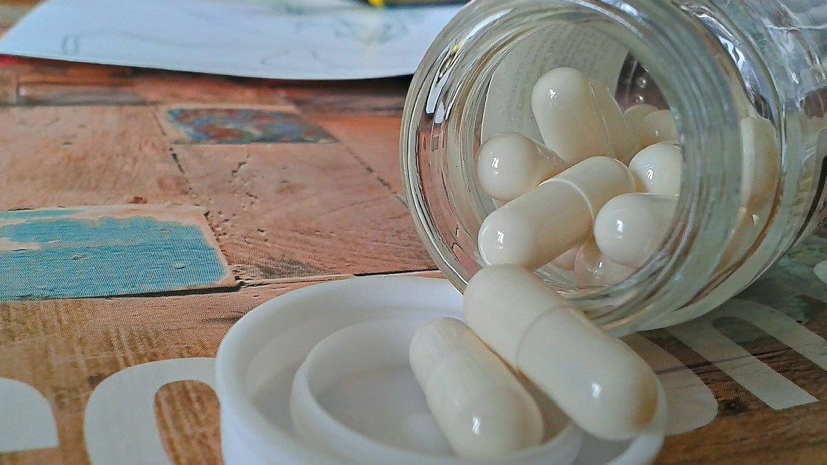 Pill bottle with white pills